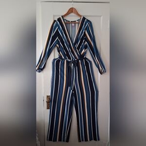 ✨ Elevate your wardrobe with this chic striped jumpsuit ✨